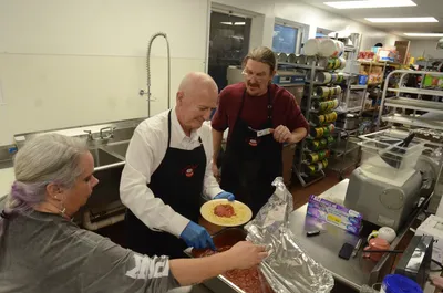 Volunteers preparing and serving meals at the Hickory Soup Kitchen dining area